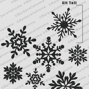 May include: Black snowflake stencils in various sizes, with the largest measuring 4 feet tall and the smallest 2.5 feet tall. The stencils are for winter-themed crafts and decorations.
