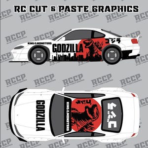 May include: White car graphic with Godzilla design. The car features the text "GODZILLA" and "KING OF MONSTERS" with Japanese characters. The design includes a red circle with Godzilla's silhouette and a city skyline.