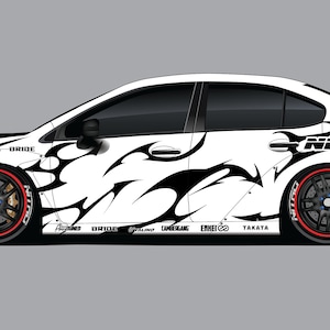 May include: White sports car with black tribal graphics and red-trimmed wheels. The car features a large rear wing and the word "Nitto" on the side. The car is set against a gray background.