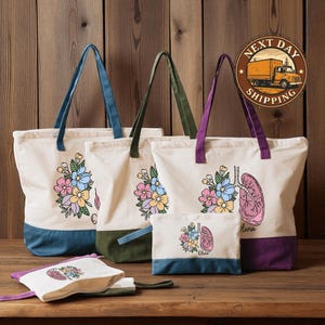 a collection of colorful tote bags and a small bag with floral designs, displayed on a wooden surface.