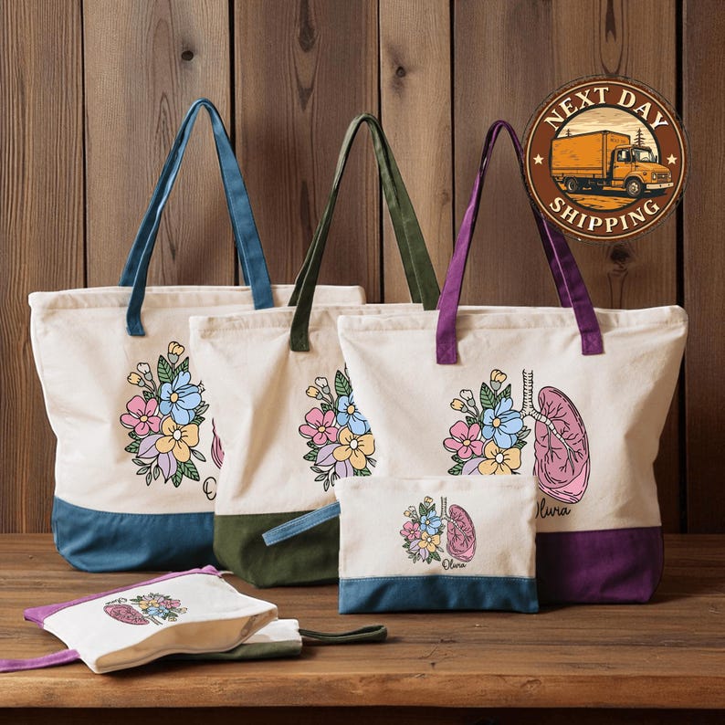 a collection of colorful tote bags and a small bag with floral designs, displayed on a wooden surface.