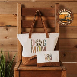 A wooden chair with a tote bag and a small bag on it, placed against a wooden wall.