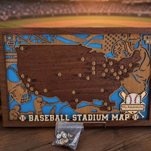May include: A rectangular wooden wall art piece featuring a layered map of the United States with baseball stadium locations marked by small circles. The design includes baseball player silhouettes, the text "BASEBALL STADIUM MAP" and "My Adventures".