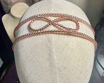 Faixa de cabeça com anel tensor de cobre
