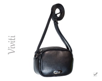 Charming black genuine leather purse.