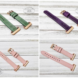 May include: Four watch straps in green, purple, dusty pink, and rose pink. Each strap has a gold-coloured buckle and connectors. The text "GREEN", "PURPLE", "DUSTY PINK", and "ROSE PINK" are in the image.