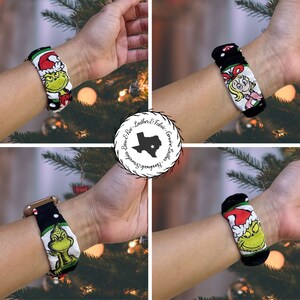 May include: Four different watch bands with Christmas-themed designs. The bands are black with white polka dots and feature images of the Grinch, Cindy Lou Who, and Santa Claus.