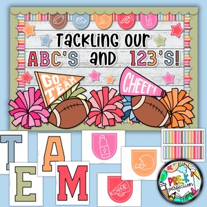May include: A classroom bulletin board decorated with a football theme. The board has the text "Tackling our ABC's and 123's!" and features pom-poms, footballs, and a megaphone with the word "CHEER!"  The letters T, A, M, and E are displayed below the board.