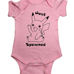 May include: Pink baby onesie with a black and white illustration of Pikachu and the text "Just Spawned".