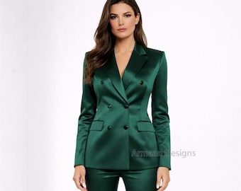 May include: A dark green satin double-breasted suit. The suit features a blazer with a notched lapel and two rows of buttons, and matching trousers. The image shows the suit on a person against a white background. The text "Armaan Designs" is visible.