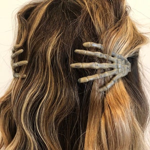 Halloween creepy skeleton hands hair clips with spooky glow in the dark option image 1