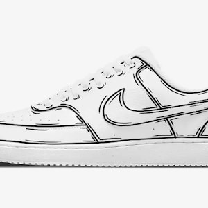 May include: A white leather low-top sneaker with black outline details. The sneaker features a black Nike swoosh logo and a white rubber sole.