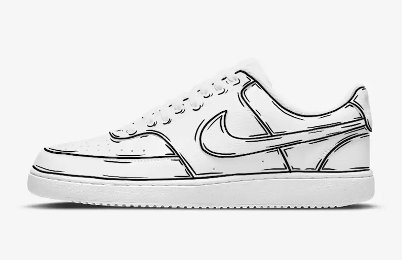 May include: A white leather low-top sneaker with black outline details. The sneaker features a black Nike swoosh logo and a white rubber sole.