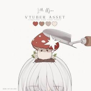 May include: A digital illustration of a white-haired character head accessory featuring a red mushroom with white spots, small white flowers, and brown soil. A metal garden trowel with a wooden handle is positioned above the mushroom.