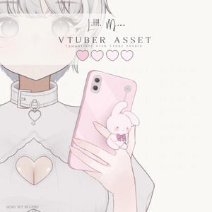 May include: A digital illustration of a character holding a light pink smartphone with a small white bunny charm attached. The character wears a white high-neck garment with a heart-shaped cutout. Text reads Little Moon VTUBER ASSET.