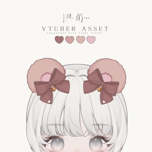 May include: A digital illustration of a VTuber asset featuring fluffy, rounded, light pink animal ears adorned with dark brown bows. Each bow is accented with a small gold heart charm and a tiny white heart detail. The text reads Little Moon VTUBER ASSET.