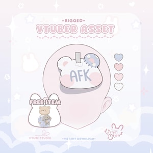 May include: A digital asset for VTubers, featuring a bear-shaped design with the text "AFK" and a free item graphic. The image has a soft, pastel color scheme with hearts and stars, and the text "VTUBE STUDIO" is visible.