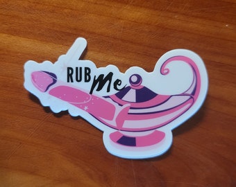 Funny Genie Rub Me Sticker with an Adult theme at the end of the spout, pink humor sticker for the alternative lifestyle