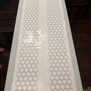 May include: A rustic wooden sign with the text "Welcome to our home" in white lettering. The sign features a distressed finish and a simple, inviting design, perfect for front door decor.