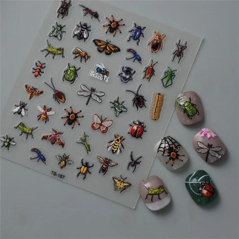 May include: A sheet of colorful insect stickers with a variety of designs, including butterflies, ladybugs, spiders, and ants. The sheet is labeled "Insects" and has the product code "TS-167".