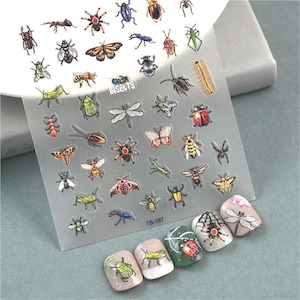 May include: A sheet of clear plastic with colorful insect stickers. The stickers feature a variety of insects, including butterflies, beetles, ants, and ladybugs. The sheet is labeled "Insects" and "TS-187".