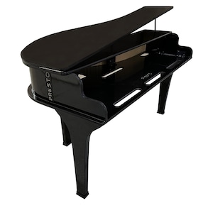 May include: A black, modern-style piano with a glossy finish. The piano has a curved shape with a raised lid and the word "PRESTO" printed on the side. The piano has a unique design with cut-out sections and angled legs.