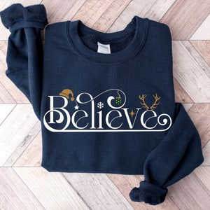 Believe Christmas Sweatshirt, Womens Christmas Sweatshirt, Believe Shirt, Christmas Party Shirt,Christmas Sweatshirt, Christmas Family Shirt