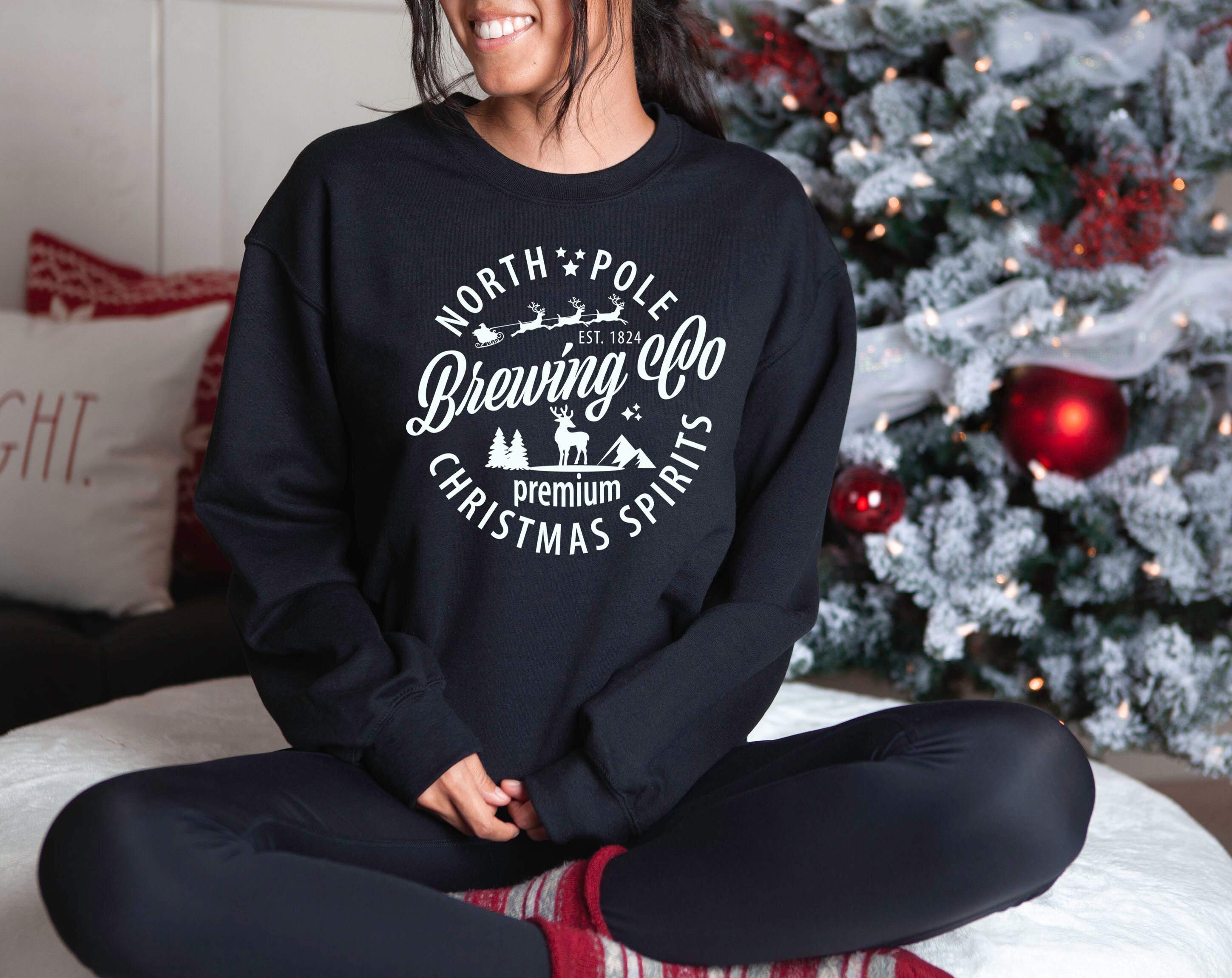 North Pole Brewing Co Christmas Spirits Camisa del Polo Norte