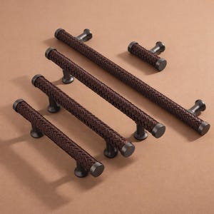 May include: A rustic wooden sign with the text "Welcome to our home" in white lettering. The sign features a distressed finish and a simple, inviting design, perfect for a front porch or entryway.