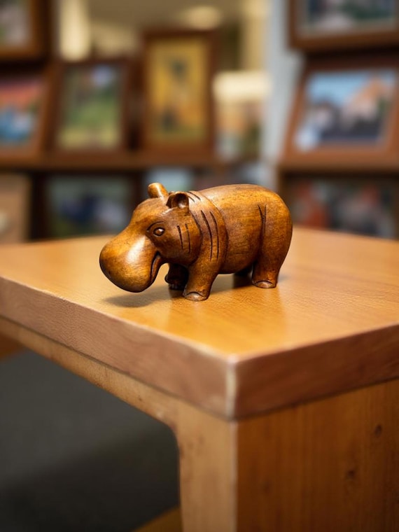 Moo Deng Hippopotamus wooden statue.