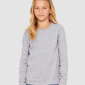 May include: A heather gray long-sleeve t-shirt for kids. The shirt has a crew neck and is made of a soft, comfortable fabric.