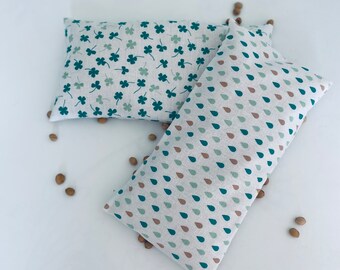 Dry hot water bottles with removable cherry pit covers