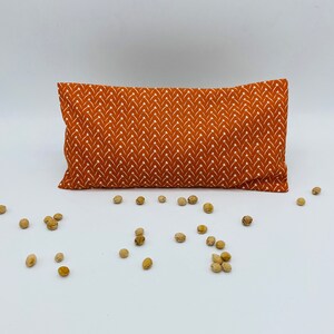 Dry hot water bottle with removable cherry stone cover 45 Géométrie orange