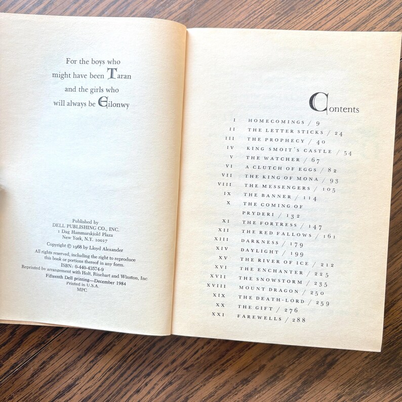 The image displays the opening pages of the book "The High King" featuring a dedication and a table of contents. The dedication reads, "For the boys who might have been Taran and the girls who will always be Gilonwy."