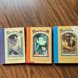 A Series of Unfortunate Events - The Miserable Mill - The Hostile Hospital - The Carnivorous Carnival - Three Vintage Paperbacks