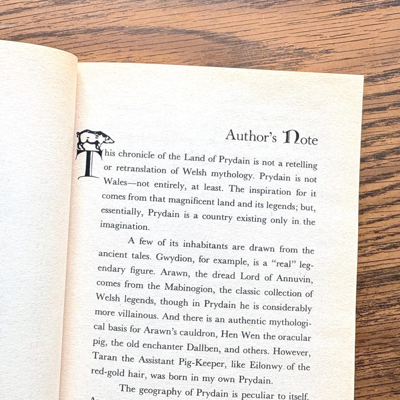 The image shows an Author's Note discussing the inspiration for the Land of Prydain, which draws from Welsh mythology and legends. It mentions specific characters like Gwydion and Arawn.