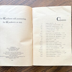 The image shows a table of contents for the book "Taran Wanderer" with a dedication on the left page. The table of contents on the right page lists chapter titles beginning with "Who Am I?".