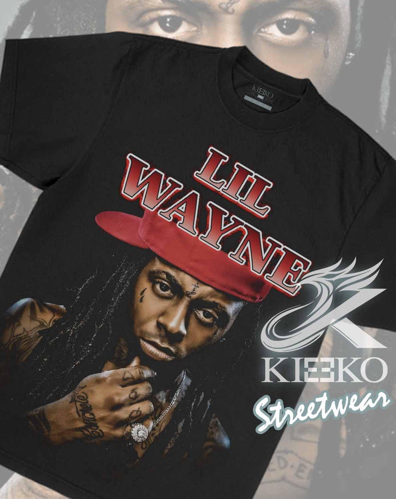 May include: Black t-shirt featuring a portrait of Lil Wayne wearing a red hat, with the text "LIL WAYNE" in red and white. The shirt also includes the "KIEKO STREETWEAR" logo.