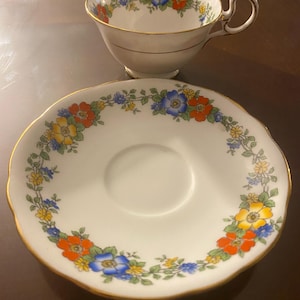 Antique  Aynsley teacup and saucer with art deco style floral ring adorning inner cup and saucer. 1930’s 1940’s