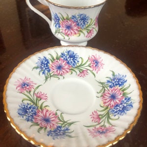 Beautiful unnamed PARAGON teacup and saucer with lovely blue and pink flowers in vintage floral array