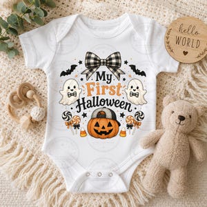 May include: A white baby bodysuit featuring a graphic print with the text My First Halloween, a black and white plaid bow, two ghosts with bow ties, a pumpkin wearing a baseball cap, lollipops, candy corn, and small black bats.