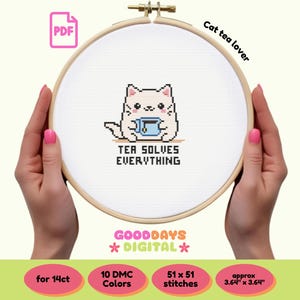 May include: A cross-stitch pattern featuring a cartoon cat holding a cup of tea with the text "Tea solves everything" and the words "Cat tea lover" above the cat. The pattern is for 14 count Aida cloth and uses 10 DMC colours. The finished size is approximately 3.64 inches by 3.64 inches.