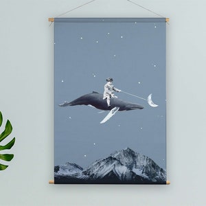 May include: A blue whale with a person riding on its back, flying through a starry night sky. The whale is holding a crescent moon in its mouth. The background is a blue sky with white stars.