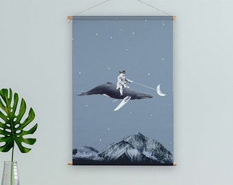 May include: A blue whale with a person riding on its back, flying through a starry night sky. The whale is holding a crescent moon in its mouth. The background is a blue sky with white stars.