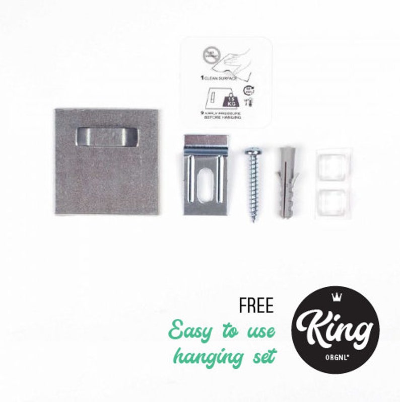 May include: A silver metal hanging system with a screw, a plastic anchor, and a metal plate. The system is labelled "FREE Easy to use hanging set" and "King ORGN'L".