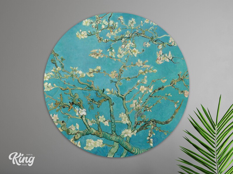 May include: A round wall art print featuring a painting of a blooming almond tree with white flowers against a blue sky. The painting is in the style of Vincent van Gogh.