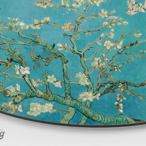 May include: A painting of a blossoming almond tree with white flowers against a bright blue sky. The branches are depicted in a swirling, expressive style, typical of the artist's work.