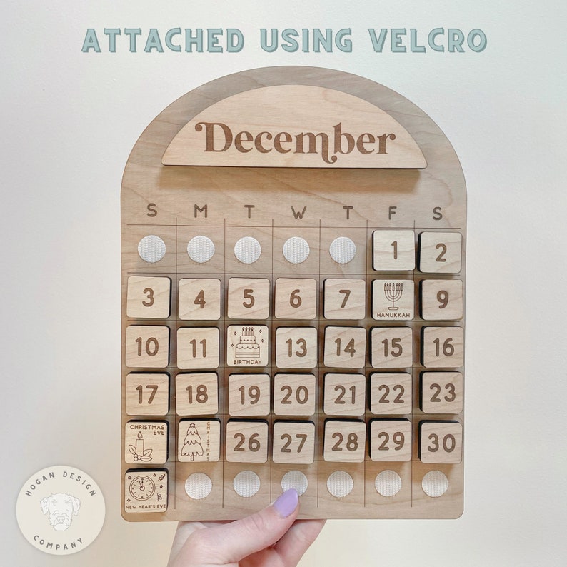 May include: Wooden calendar with removable blocks for each day of December. The calendar features a variety of holidays including Hanukkah, a birthday, Christmas Eve, and New Year's Eve.