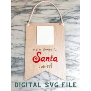 May include: A wooden sign with a white space for a number, with the text "more sleeps til Santa comes!" in brown and red lettering. The sign is hanging from a white rope.