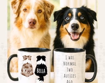 May include: Two Australian Shepherd dogs with mugs. One mug features the names "Milo" and "Bella" with dog illustrations. The other mug reads "I WAS NORMAL TWO AUSSIES AGO." The mugs have black handles and rims.